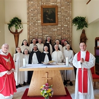 The first profession of Sister Catherine Marie with Fr. Don Goergen, OP and Fr. Dominic Rankin